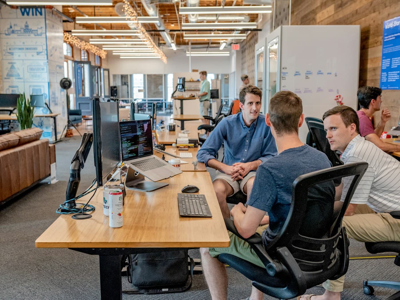 Enterprise sales team in a pipeline review meeting with performance data