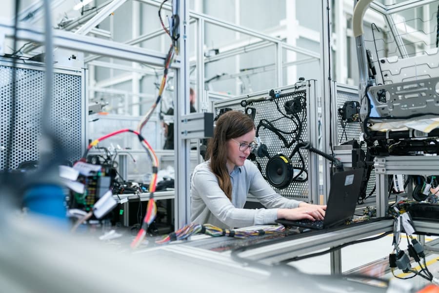 Modern manufacturing facility with engineering team reviewing production planning